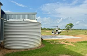 50000 litre Round water tank by shed